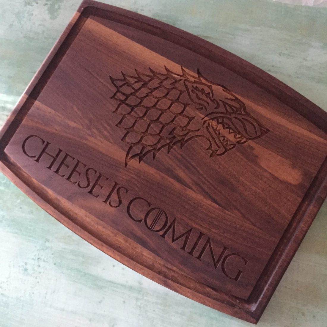 'Cheese is coming' cutting board